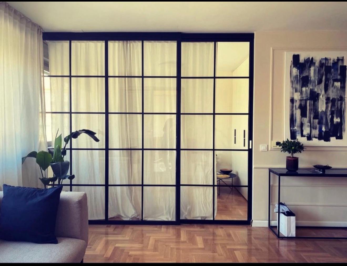 Internal steel sliding doors with glazed panels